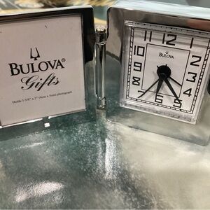 Bologna Chrome clock/alarm clock.  Comes with photo frame, 2 X 2 1/4”